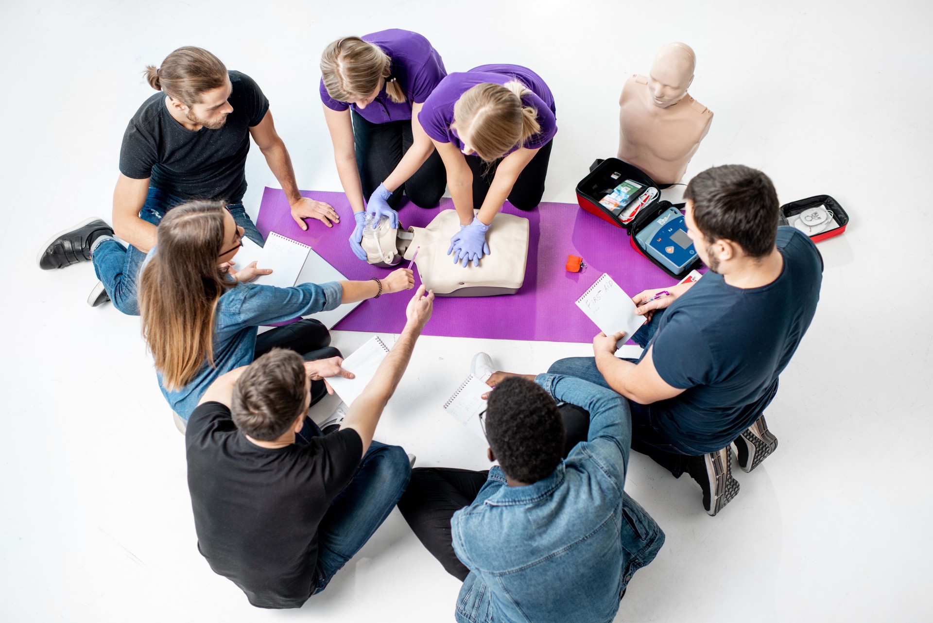 Group of young people during the medical first aid courses indoors
